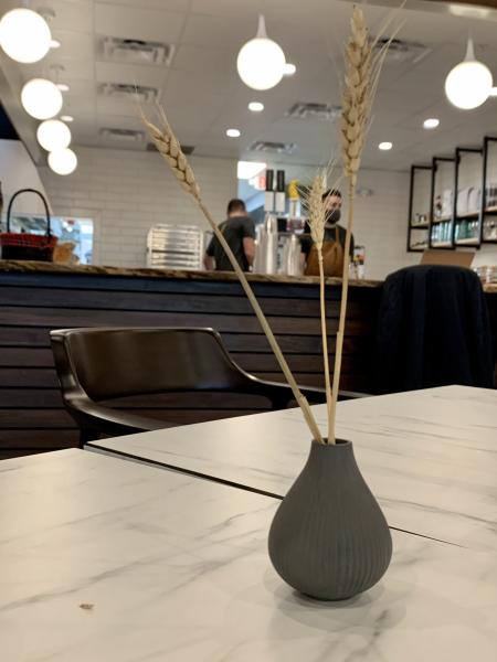 Decorative vases of wheat add to the decor of In Grano.