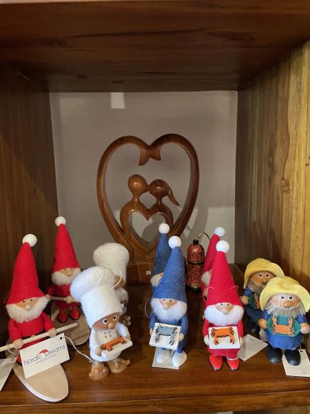 Estonian hand carved wooden Santas holding crabs