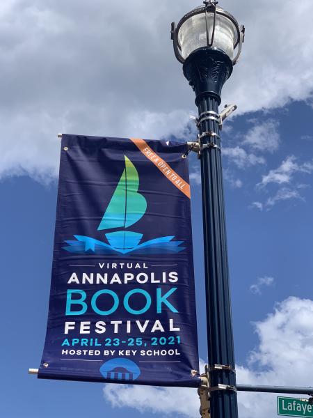 An Annapolis Book festival sign in a lampo post