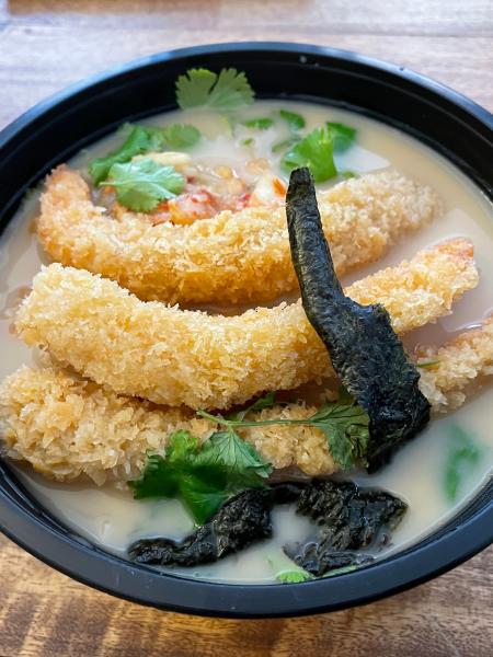 Shrimp tempura over ramen.