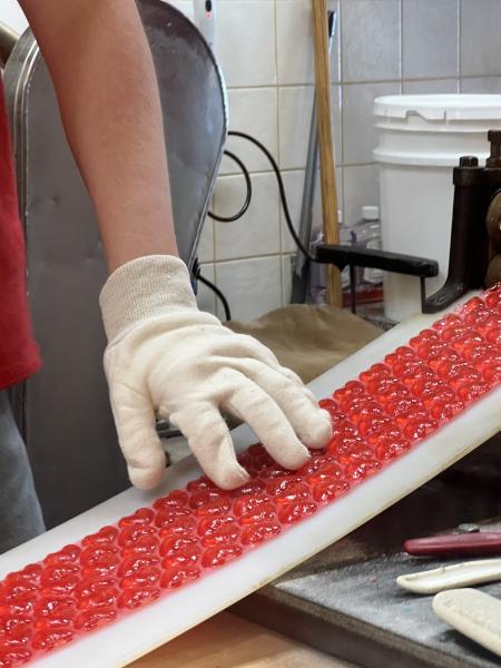 Schimpff's Red Hots coming down the candy-making machine.