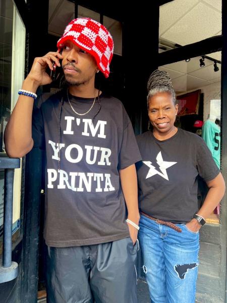 Starstrukt Apparel Owners outside of their store.