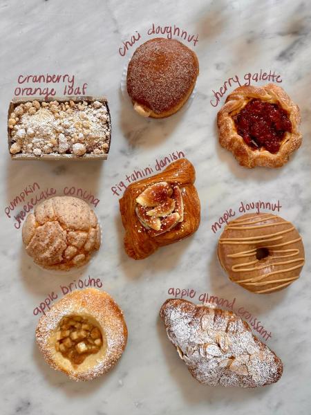 A group of pastries, labeled by name, at The Station On Kings.