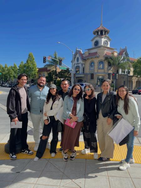 Travelers from the Mexico Reverse Mission pause for a photo outside of the historic Old CityHall building in downtown Gilroy, California.