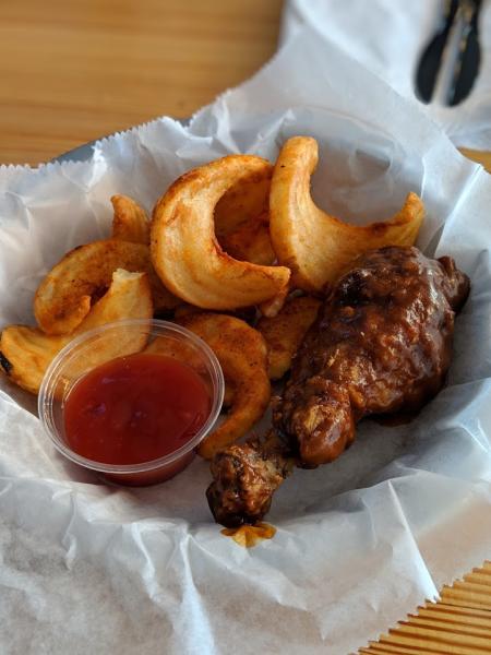 chicken wing with bbq sauce and curly fries at rich's proper foods in covington ky