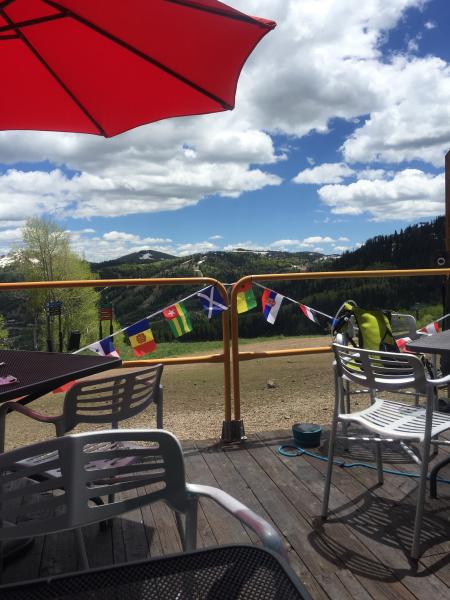 Outdoor patio chairs, table, and umbrella
