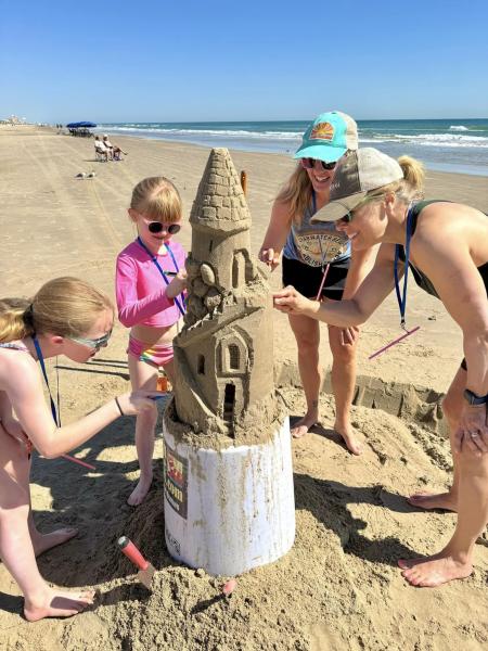 Family Building a Sandcastle (Andy Hancock)