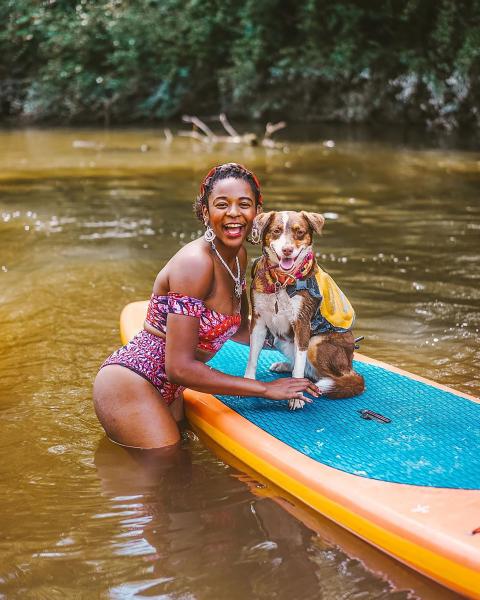 Woman With Dog Stand-up paddling on the Bogue Falaya River with Canoe and Trail Adventures