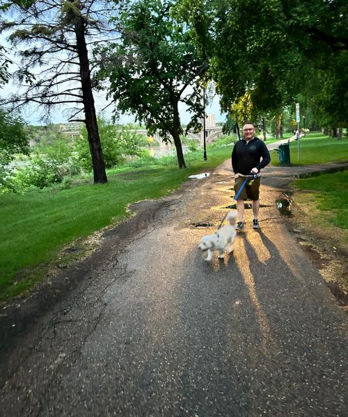 Eric Anderson walking his dog