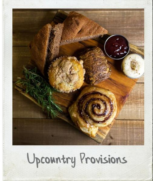 A Polaroid photo of breads and pastries from Upcountry Provisions in Travelers Rest, SC.