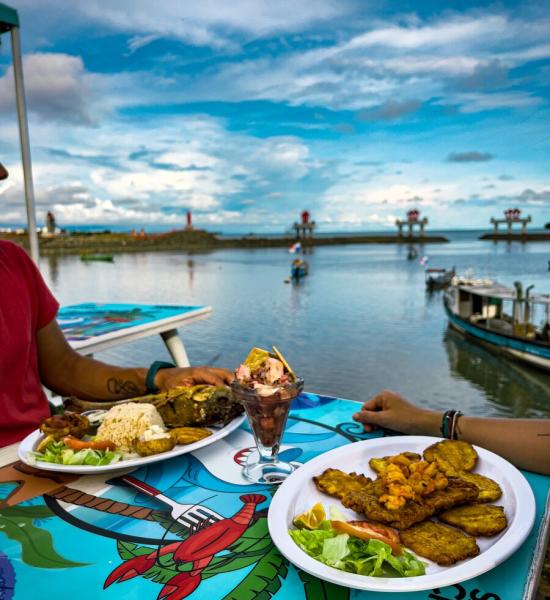 Seafood dishes near the shore on a coloful table