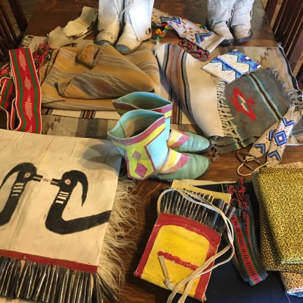 A collection of Native American and Western goods sit on a table