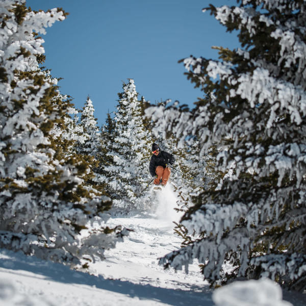 Person jumping on a snowboard at Ski Santa Fe