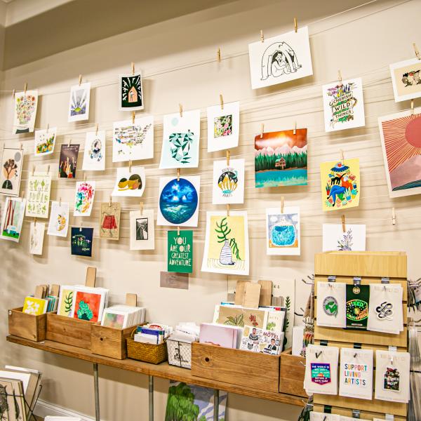 Display of wall art and prints at Gather Handmade Shoppe