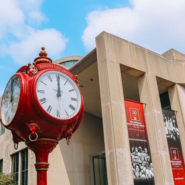 A red clock tower on IU's campus