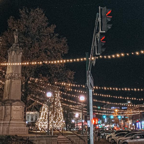 The downtown Square lit up at night during the holidays