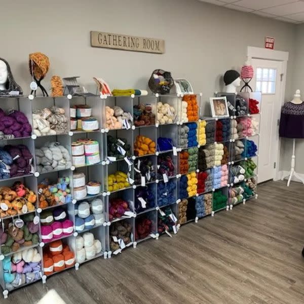 Shelves of yarn inside Yarn Works