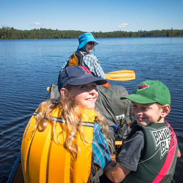 Image of a family canoeing on a Minnesota lake.