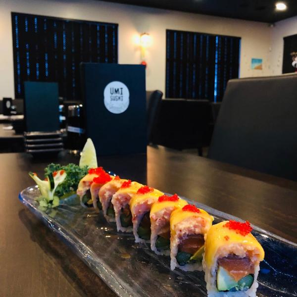 Umi Sushi sushi roll on table with menu
