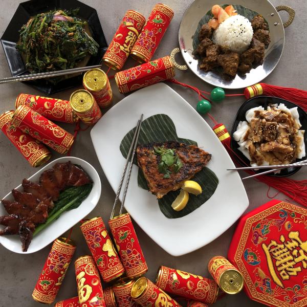 Several plates filled with traditional chinese lunar new year foods