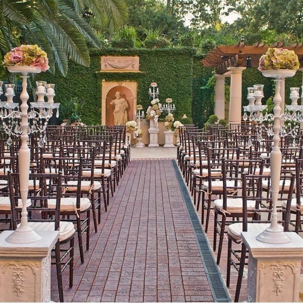 Chairs facing a wedding alter at Hotel Granduca in Houston, TX