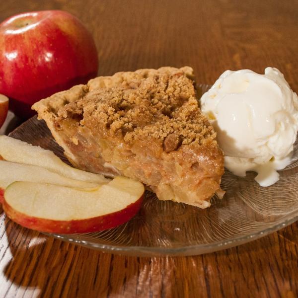 Apple pie with Ice cream on a plate at the Blue Gate in Shipshewana