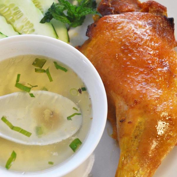 Baked Chicken with a side of broth from the Sticky Rice Cafe