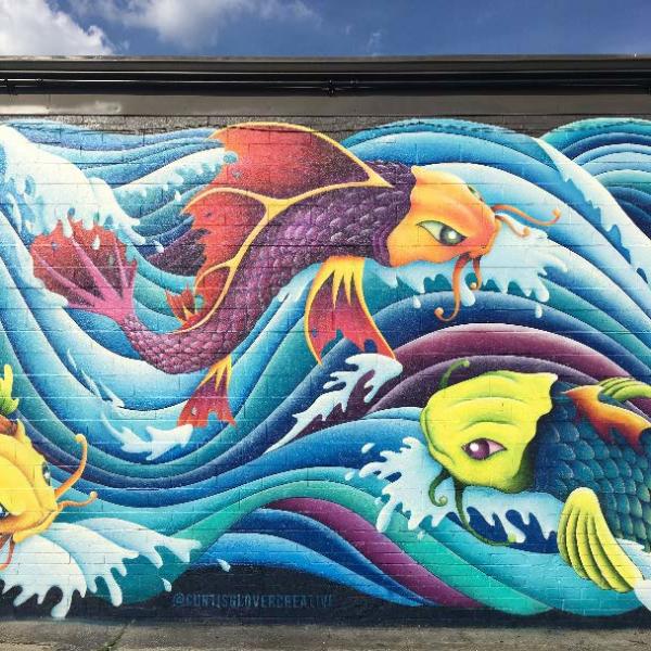 The Koi Fish Mural by Curtis Glover Creative decorates a wall at The Southern Market in Knoxville.