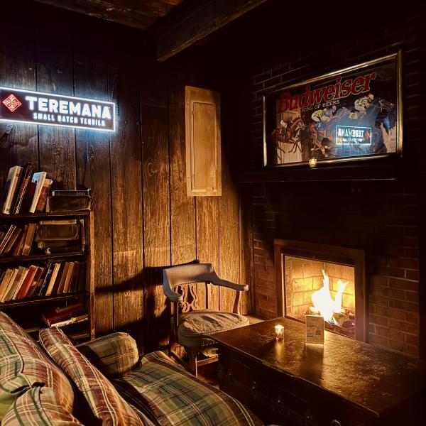 Couch in front of a fireplace