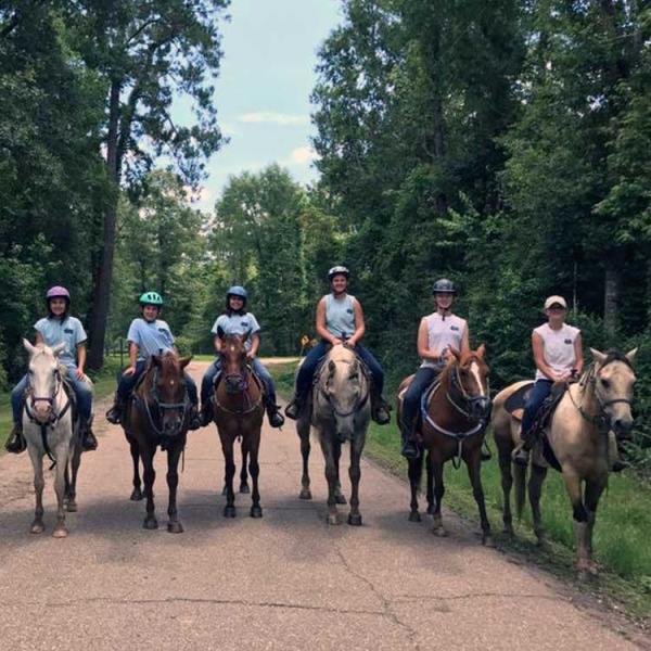 Riding horses at Splendor Farms' equestrian facility