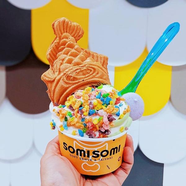 Soft serve ice cream with sprinkles and fish-shaped waffle cone at Somi Somi
