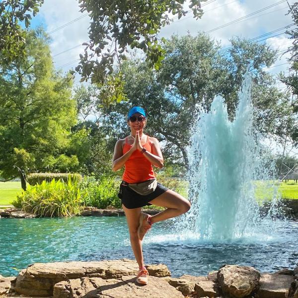 Woman posing in yoga pose at Oyster Creek Park