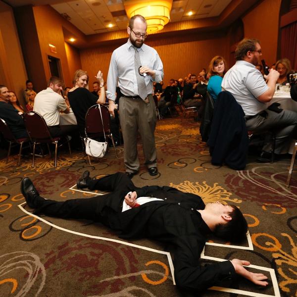 A group of participants at The Dinner Detective Comedy Murder Mystery Dinner Show