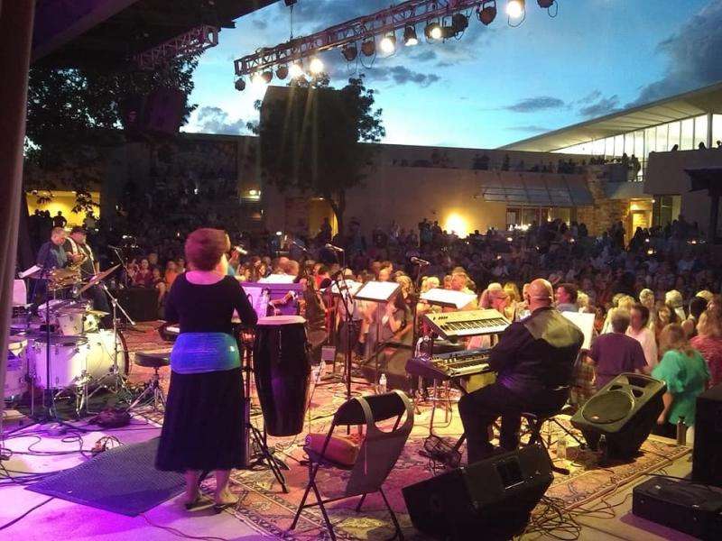 Attendees listen to a jazz performance at the Albuquerque Museum Ampitheater