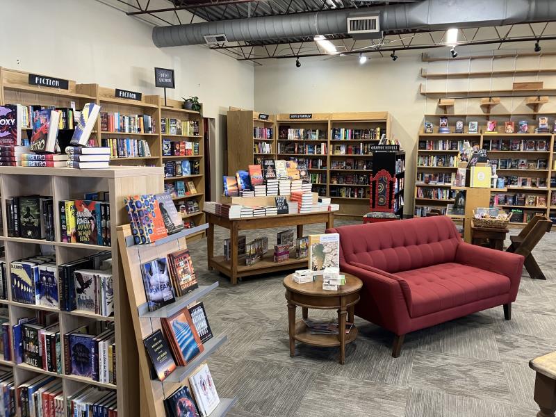 Interior of Bookworks, featuring many bookshelves and a red couch