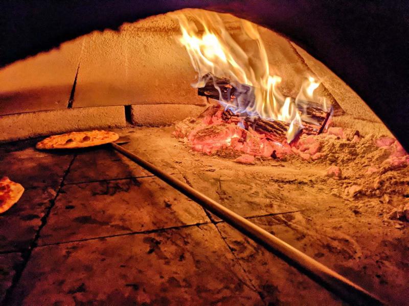 An inside look at the wood-fired pizza oven at Il Vicino.