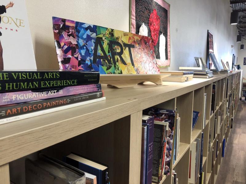 Image of the art section of books at Quirky Used Books