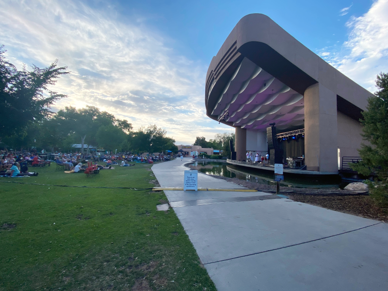 Guests listen to Grupo Bella perform at a Zoo Music concert at the ABQ BioPark Zoo