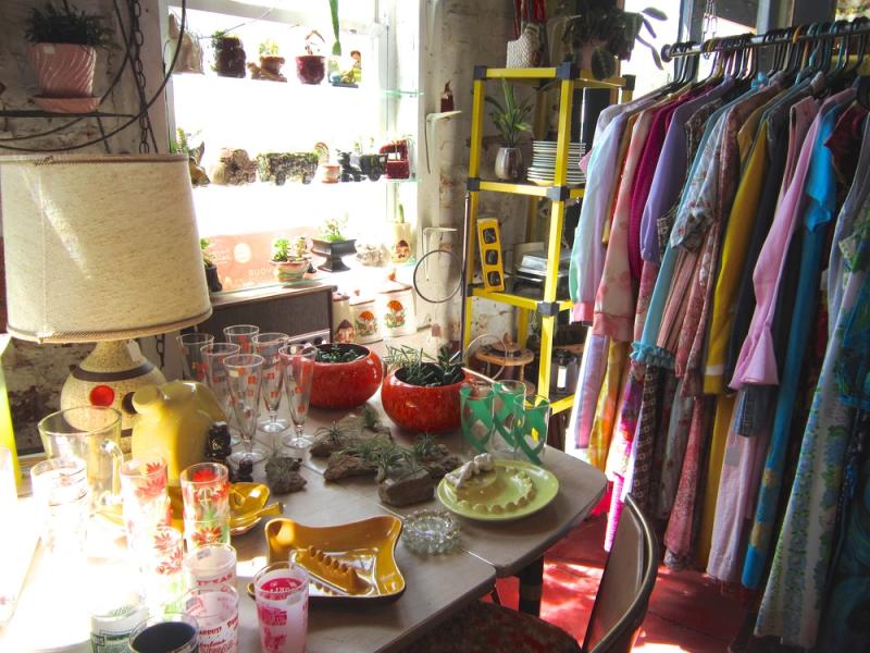 Displays of vintage home items and dresses at Cherry Canary