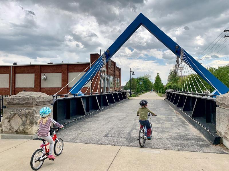 Two kids riding bikes on the B-Line Trail