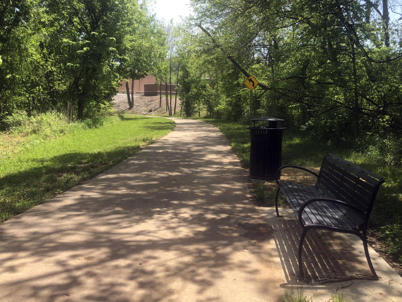 shaded paved trail near a river