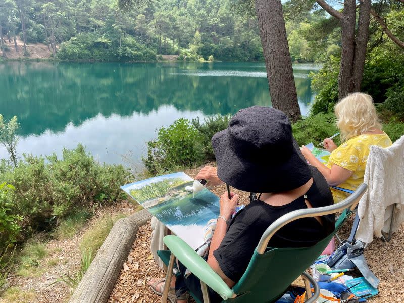 Painter enjoy the view at the Blue Pool