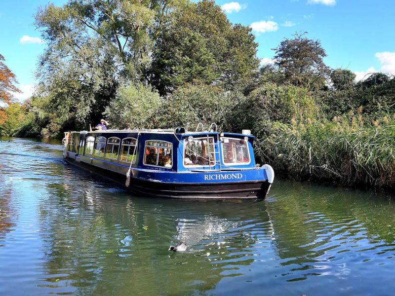 a canal boat sailing along Chichester Canal