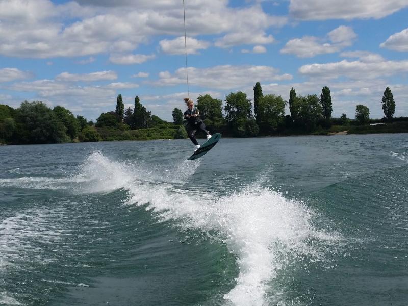 a person wake boarding on a lake