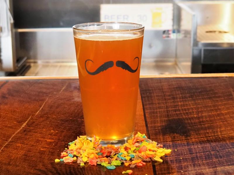 Pint of beer infused with the Fruity Pebbles cereal at Blue Wolf