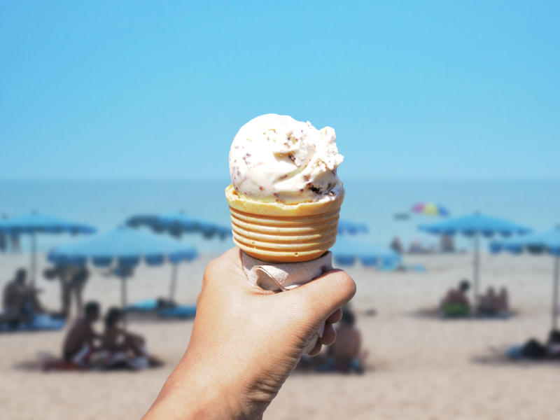 Ice cream cone in the air at the beach