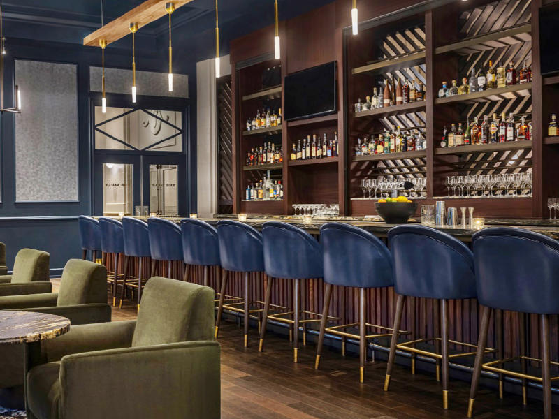 Hotel bar with blue bar stools