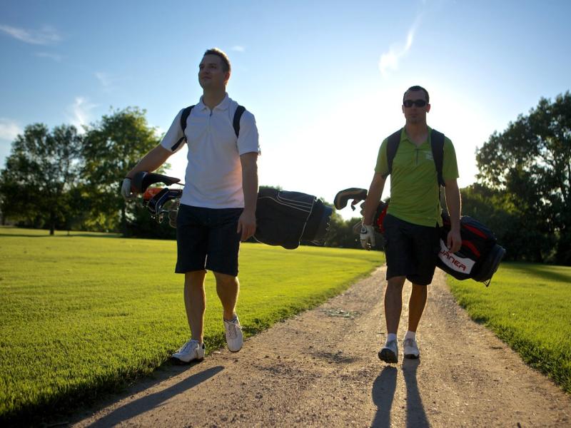 two men golfing