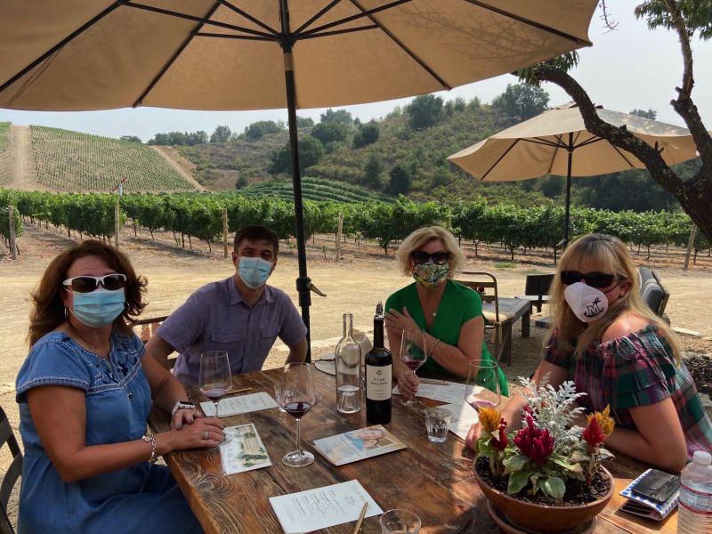 Group at winery in masks