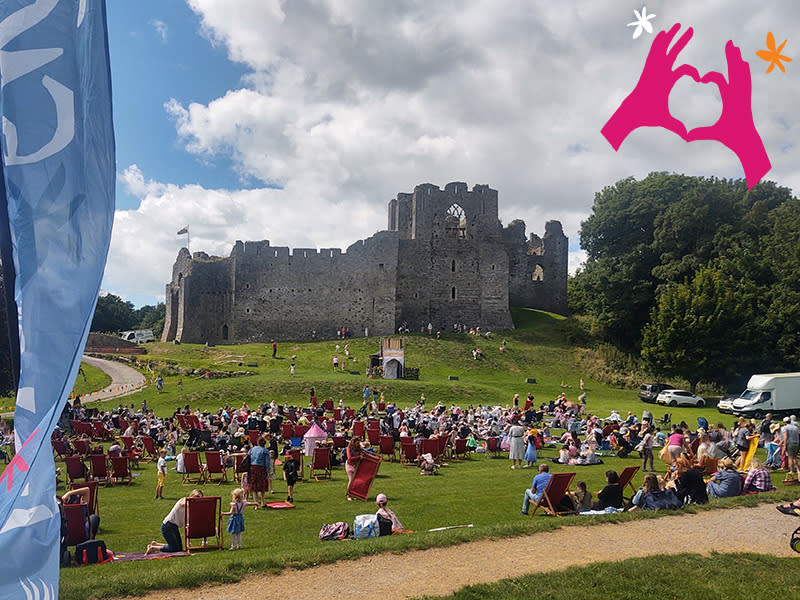 Crowds on the grass outside Oystermouth Castle.